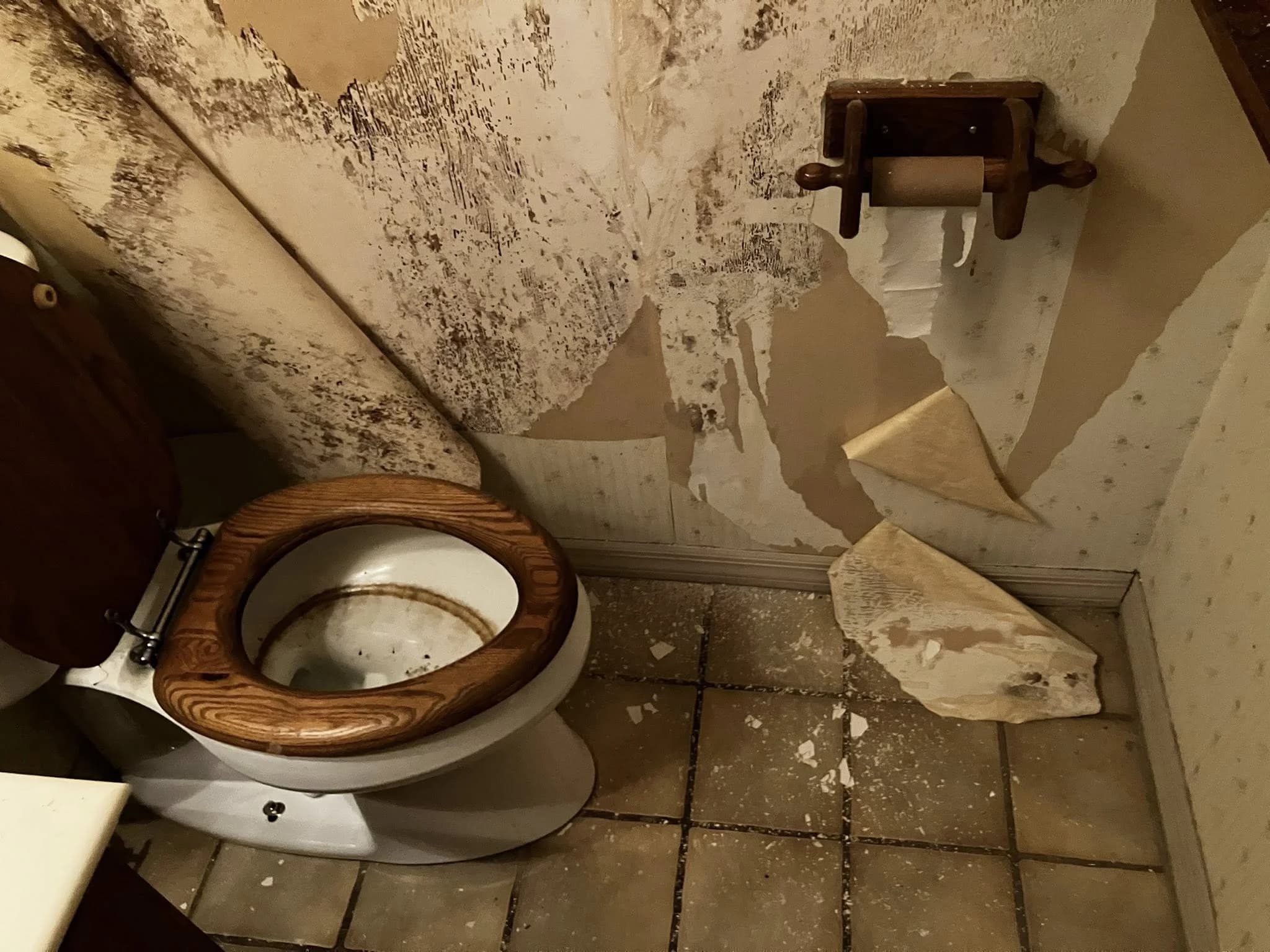 Bathroom water damage before repair