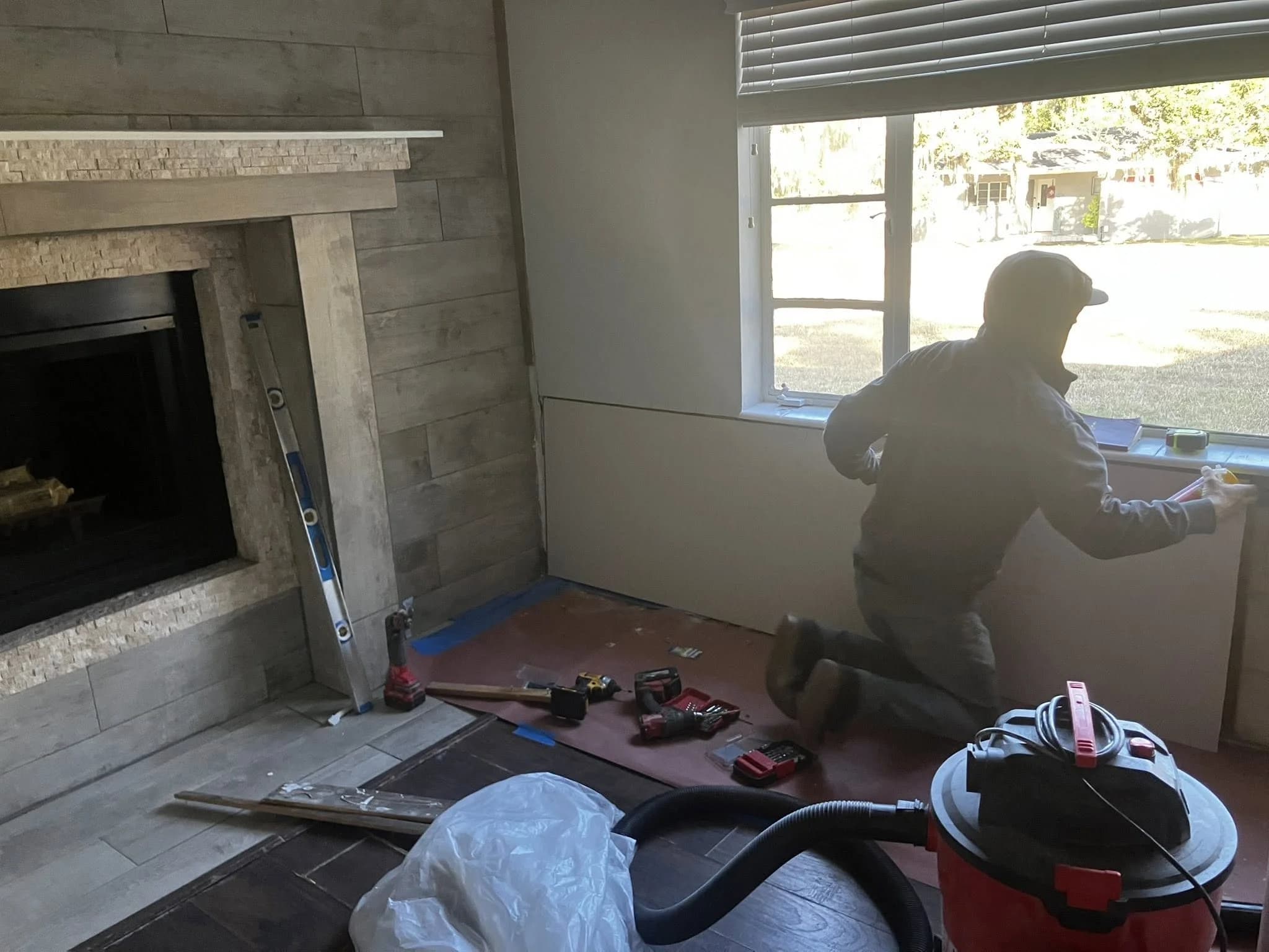 Jeffrey Coker Jr. working on a tile installation — Jeff Of All Trades